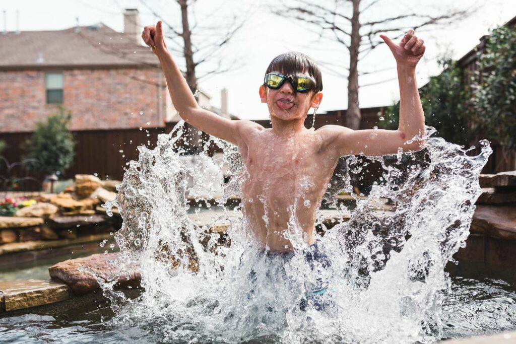 Fast Shutter Speed while child jumps out of water